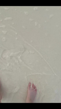Running my bare feet on the white beach sand by the ocean.