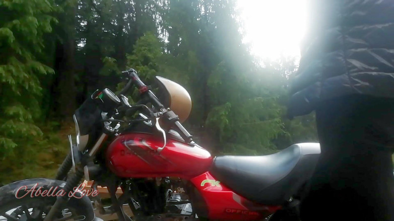 Abella Love: Red lips blonde smoking sensually on Rasta bike outdoor