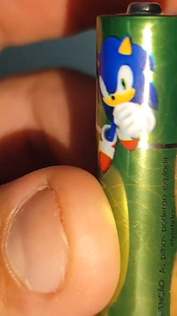 Alkaline Battery Completely Inserted Into the Cock.