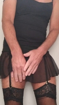 CD Trans Teases Strips Bra and Panties and Stockings Sheer Skirt
