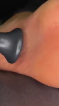 Ebony Girl Gives Her Feet a Massage with a Massage Gun