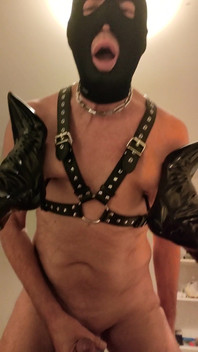 Mistress Digs the Heels of Her Boots Into Her Slave