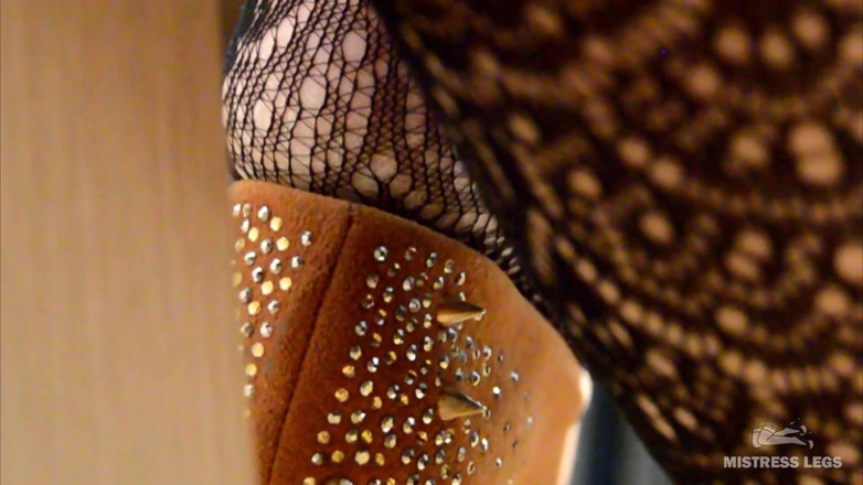 Mistress Legs: My lazy dangling shoe on the feet in black fishnets