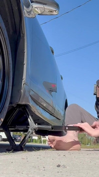 67 Tall Amazon Goddess Changes Her Tire - Big Feet in Frame