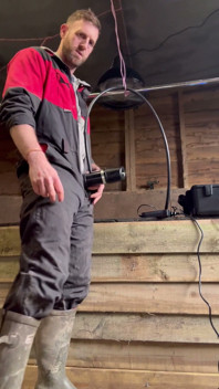 Farmer Smokes and Milks Himself with the Milking Machine