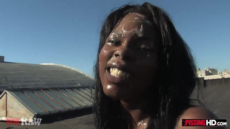 Pissing HD: Skinny ebony whore gets pissed on by two guys