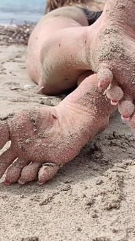 Covered in Sand and Above It All