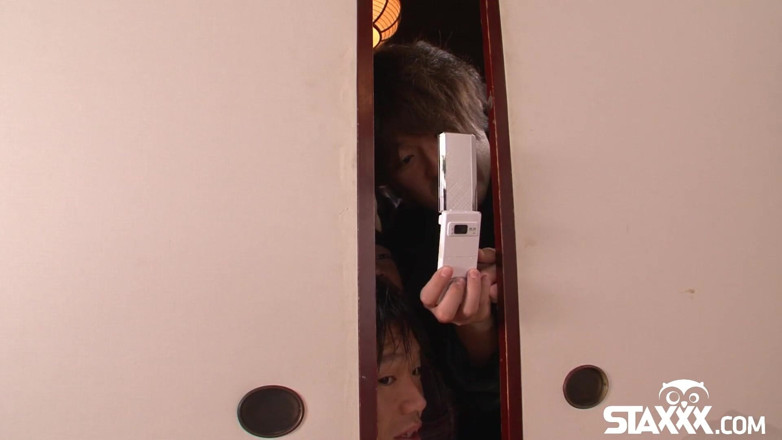 Staxxx: Japanese teen plays with her pussy while some boys watch