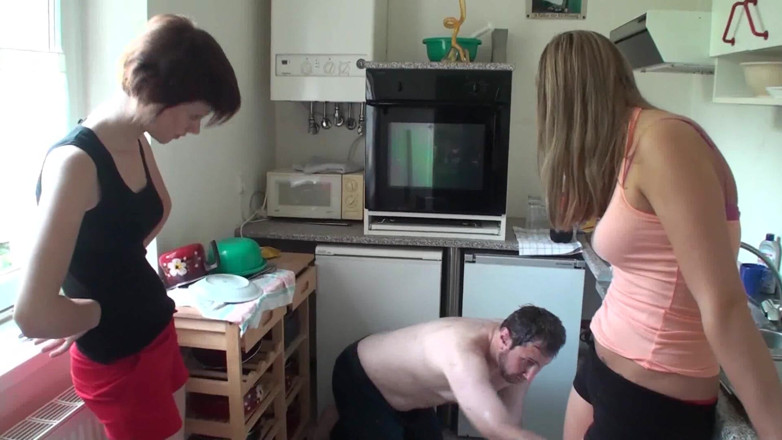 Foot Girls: Young ladies playing with their slave in the kitchen