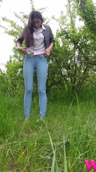 Skinny Brunette Just Had a Pee in the Tall Grass and Now She Puts on Her Jeans and Shoes
