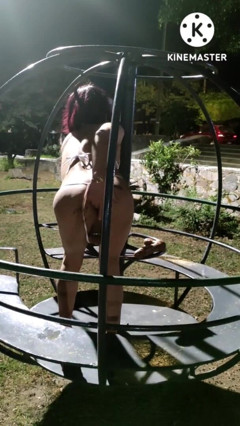 Sissy Crossdresser in Chastity and Micro Bikini Dildoing Her Ass in a Playground at Night