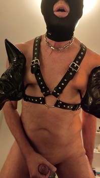 Mistress Digs the Heels of Her Boots Into Her Slave