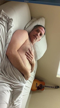 Duke Silver Plays the Trombone in Bed