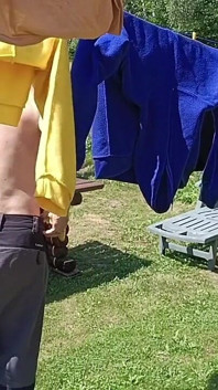Jerking off While Hanging Out the Laundry