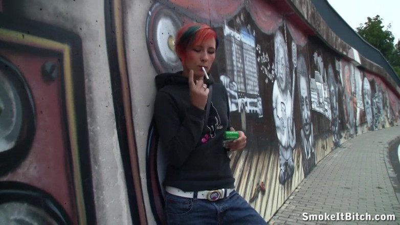 Smoke it bitch: Girl with colored hair & a pierced face smokes a cigar...