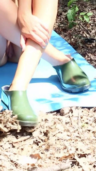 Naked Teen in the Woods Uses Scissors to Cut Her Latex Boots Into Confortable Shoes