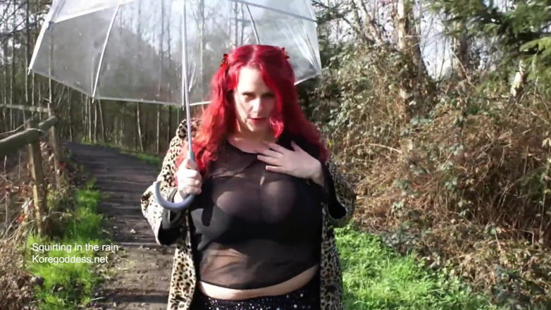 Kore Goddess: Big tits redhead squirting in the rain