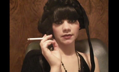 Femdom Austria: Glamorous beauty smoking a cigarette