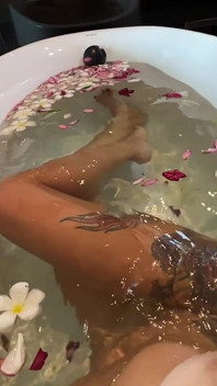 Bath of Blossoms Naked MILF Masturbates Among Flowers
