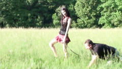 Femdom Austria: Pet on the leash in a meadow