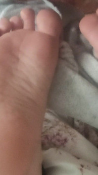 Playing with Friends Soles, While She's Reading.