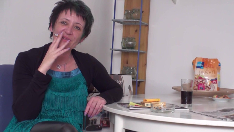 Femdom Austria: Brunette mature slut smoking a cigarette