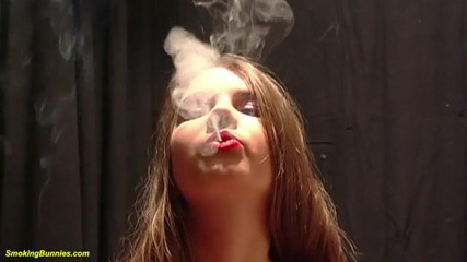 Smoking Bunnies: Cute young big boob teen smoking a cigarette