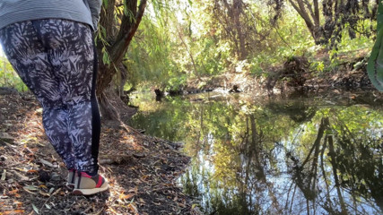 Elena: MILF dressed in leggings pissing in the river