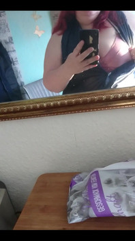 Showing off in a cool lab coat in front of the mirror