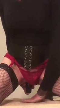 In Fishnets Sitting on Black Toy