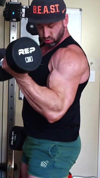 Madison Pumps Biceps and Jerks Out a Load on the Weight Bench