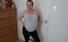 Wife Undressing in the Bedroom in Leggings