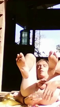 Young gay man opens his ass and sunbathes