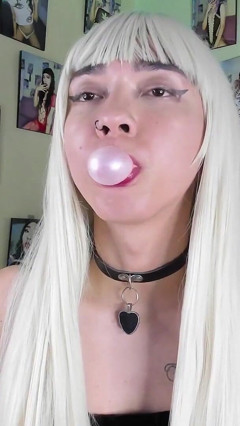 Cute teenager playing with bubble gum bombs thumbnail