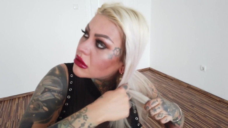 Fetish videos by Alex: Tattooed blonde MILF combing her hair.