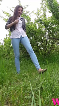 Skinny Brunette Just Had a Pee in the Tall Grass and Now She Puts on Her Jeans and Shoes