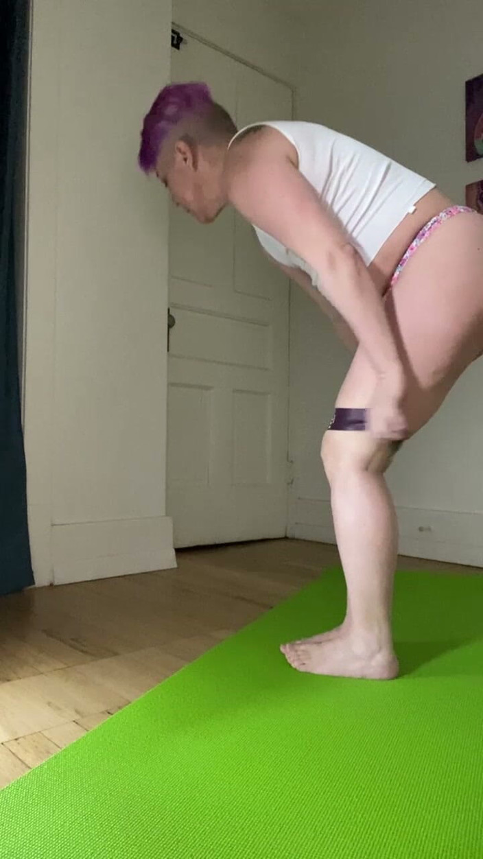 everydeygrey: Exercising with band wearing a white tank and flowery thong.