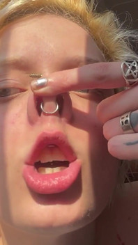 No Makeup Goth Girl in the Sun Flares Piggy Nose