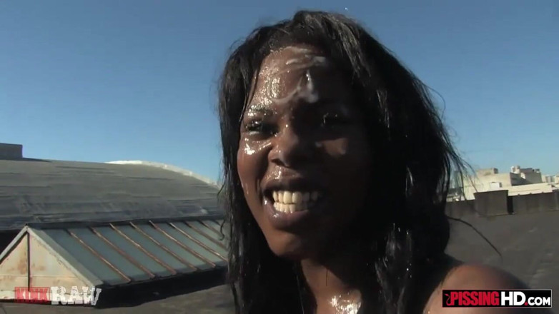 Pissing HD: Skinny ebony whore gets pissed on by two guys