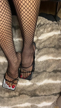 Fishnet in Open Toe Shoes with Red Nail Polish