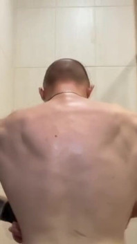 Alpha Shows off His Back Muscles