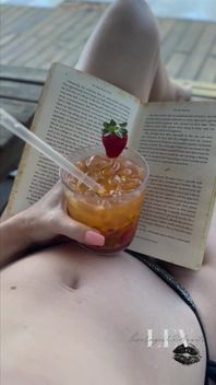 Reading by the Pool in a Bikini That Barely Counts as Spf
