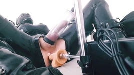 Hooded CD in latex bodysuit fucked by machine and play with ass-pussy
