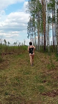 Pretty Woman Walking Through the Forest Showed Her Ass