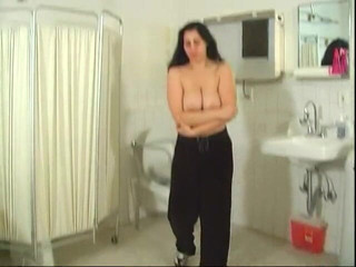 Naughty Nurses: Big tits brunette undresses for her masters inspection