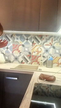The Juggler Girl Is Here in a Long School Type Uniform Skirt to Flash Her Panties Under Her Miniskirt in the Kitchen