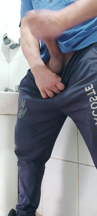 A Well-endowed Brazilian Man Urinating and Showing His Thick Penis to His Female Friends.