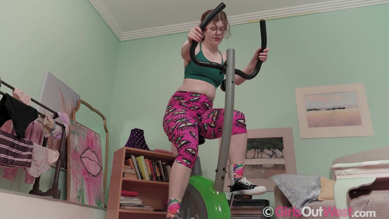 Girls Out West: Lovely hairy redhead rides spin bike and masturbates with big...