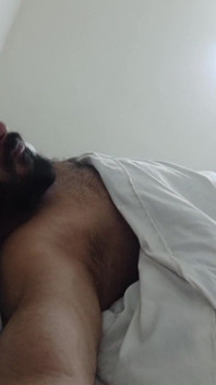 Indian Daddy Lying on the Bed Teasing and Posing for You
