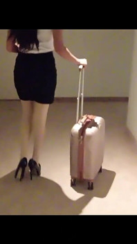 MILF in Stockings and Heels Walks Through the Corridors of a Hotel